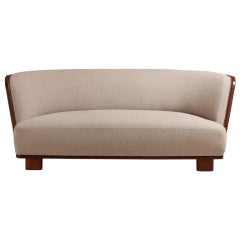 An Art Deco Walnut Framed Upholstered Sofa