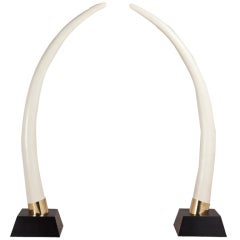 A Pair of Faux Elephant Tusks on Ebonised Bases 1970s