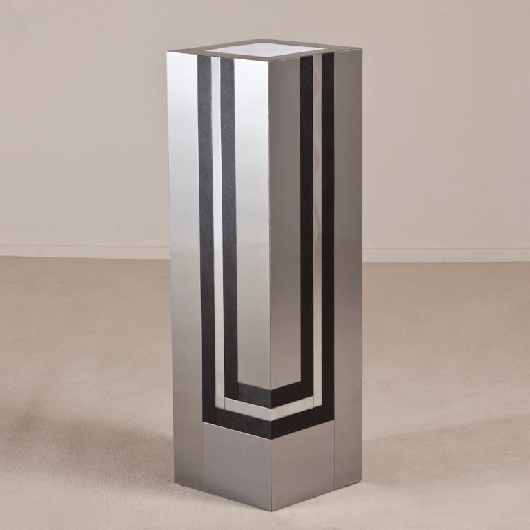 A deco inspired laminated steel and simulated leather detailed lightbox pedestal, 1970s.

Prices include 20% VAT which is removed for items shipped outside the EU.