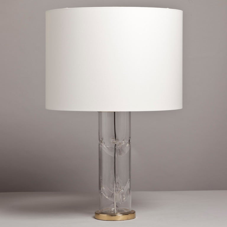 An unusual single clear glass table lamp with starfish inspired centre mounted on a brass base, 1970s.