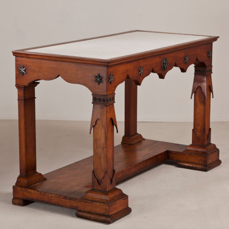 A Rare Pair of Transitional Fruitwood Console Tables from the Baltics circa 1835 with an unusual combination of both Neoclassical and NeoGothic influence, each with Original Inset White Marble Tops