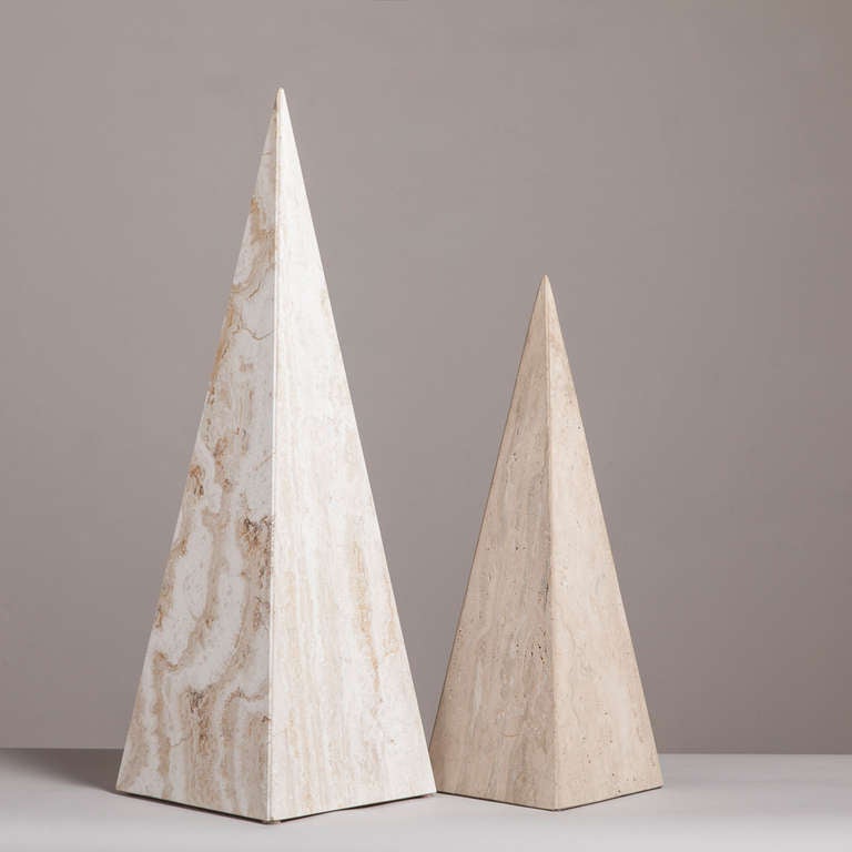 A pair of marble obelisk sculptures, 1980s. The finishes of the two obelisks are different the taller one is smooth and shiny and the smaller one is in a matte finish. 

Measures: Smaller 20cm x 20cm x 59cm high.
