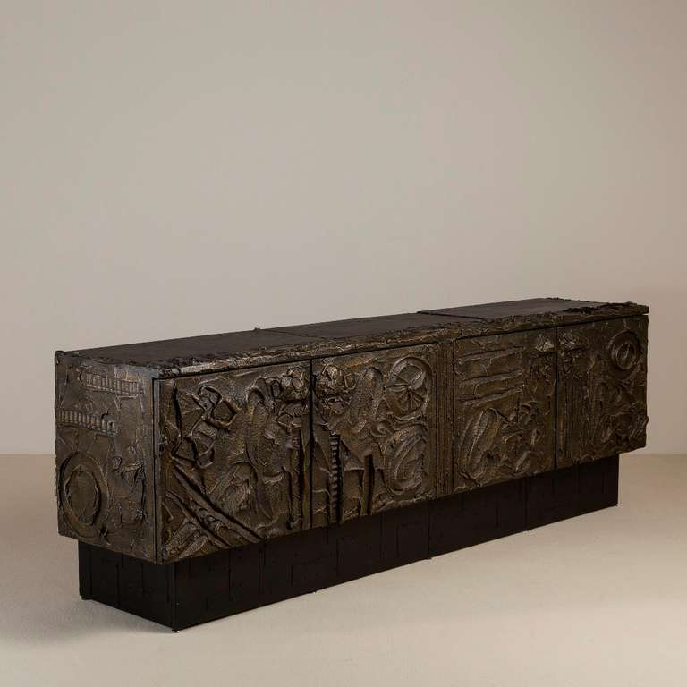 A Paul Evans for Directional Bronzed Resin Four Door Cabinet with Two Part Inset Slate Top USA signed and dated 1972