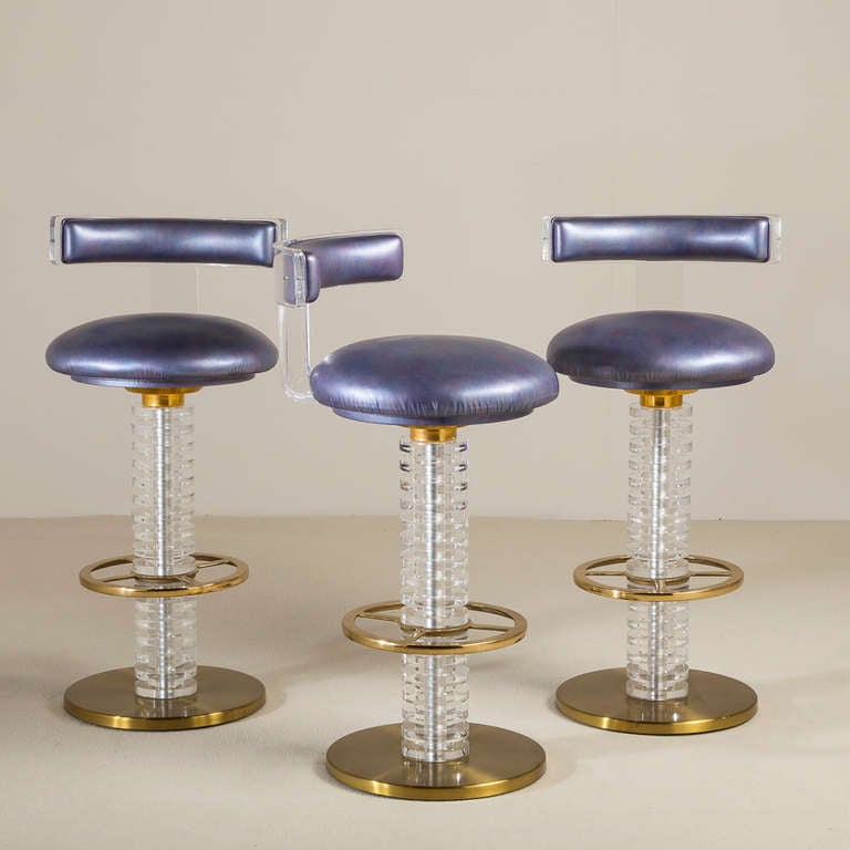 An Exceptional Set of Three Bronze and Lucite Swivel Barstools 1980s