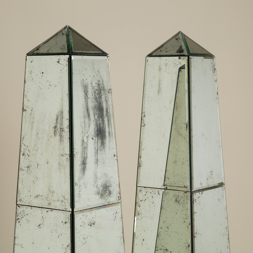 A pair of antique mirror floor standing Obelisks on silver gilt lions feet

Prices include 20% VAT which is removed for items shipped outside the EU.