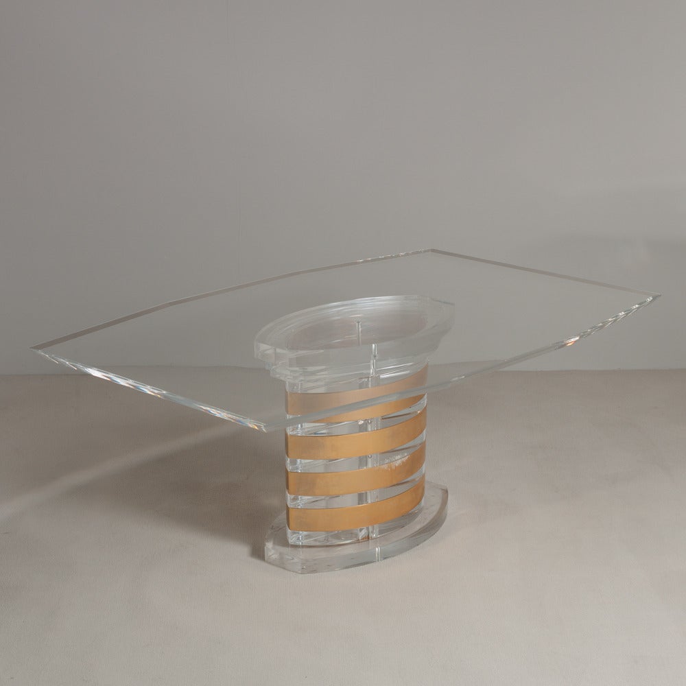 A rare Lion in Frost designed Lucite and brass banded dining table with bevelled Lucite top, 1970s.

Prices include 20% VAT which is removed for items shipped outside the EU.