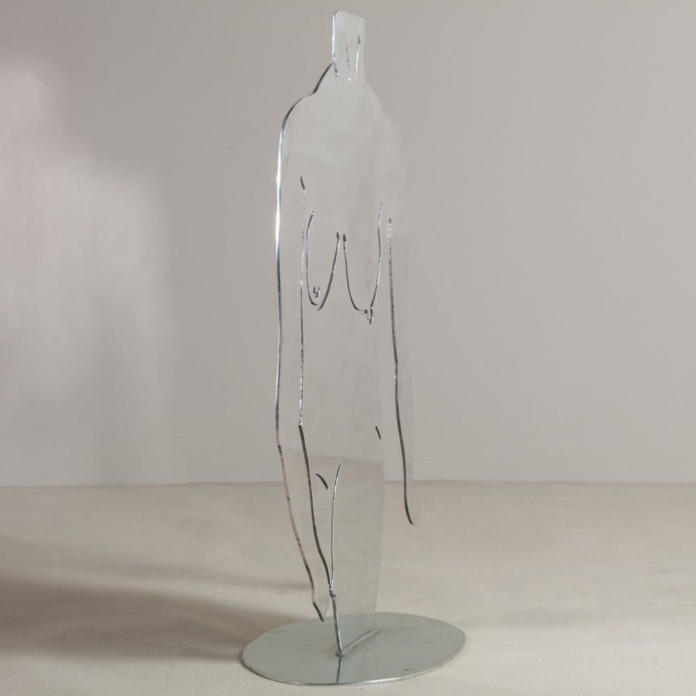 An oversized chromed steel figurative floor standing sculpture by Jack Schuyler signed and dated, 1989.
