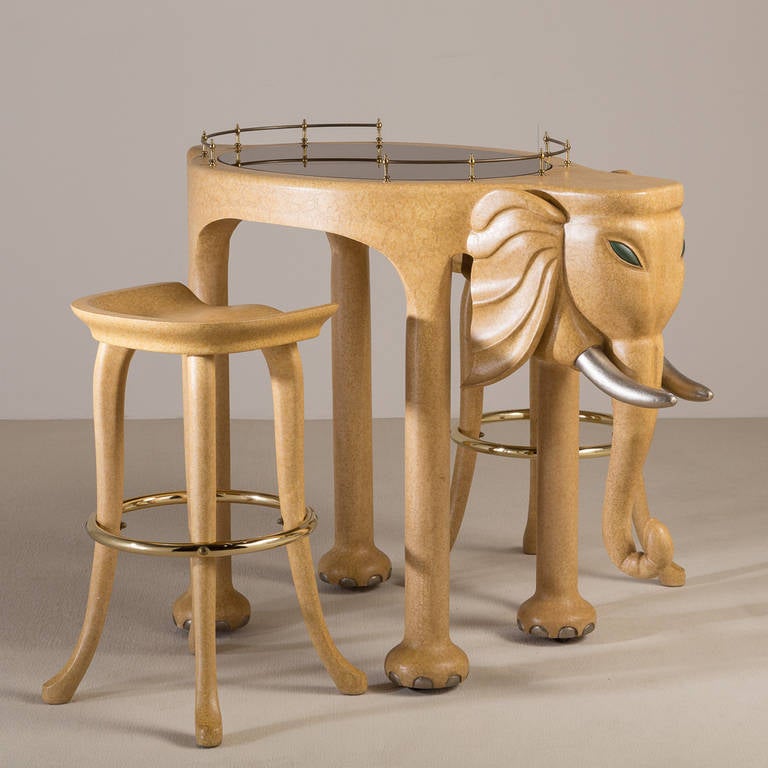A Simulated Vellum Elephant Bar on Castors and Pair of Bar Stools by Marge Carson USA

Stools measure 74.5cms x 45cms x 44cms (h x w x d)