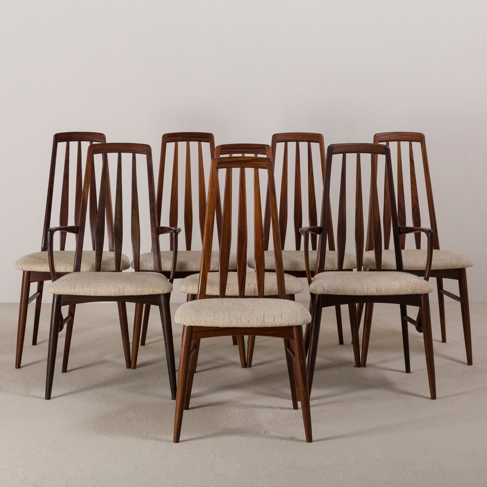 A set of eight rosewood framed upholstered dining chairs, 1960s.

Two carvers, six side chairs.