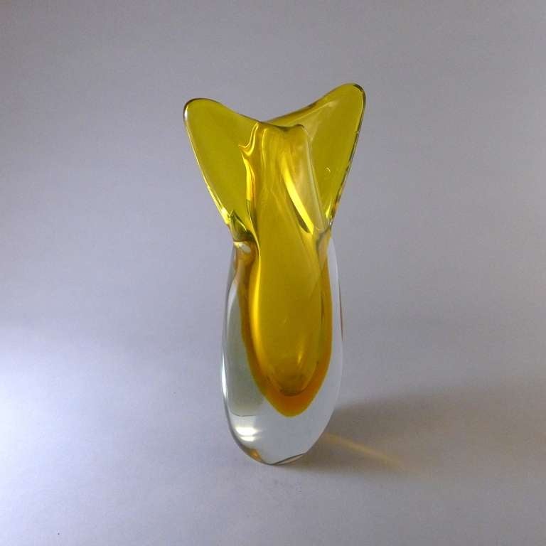 An Unusual Murano Sommerso fish tailed glass vase with a yellow and gold centre cased in clear glass.