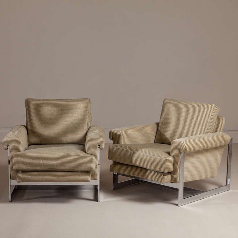 A large  pair of chromium steel framed Milo Baughman style armchairs 1970s reupholstered by Talisman.

NB: These items are subject to a further discount over and above the trade when exported outside the EU of 20%.