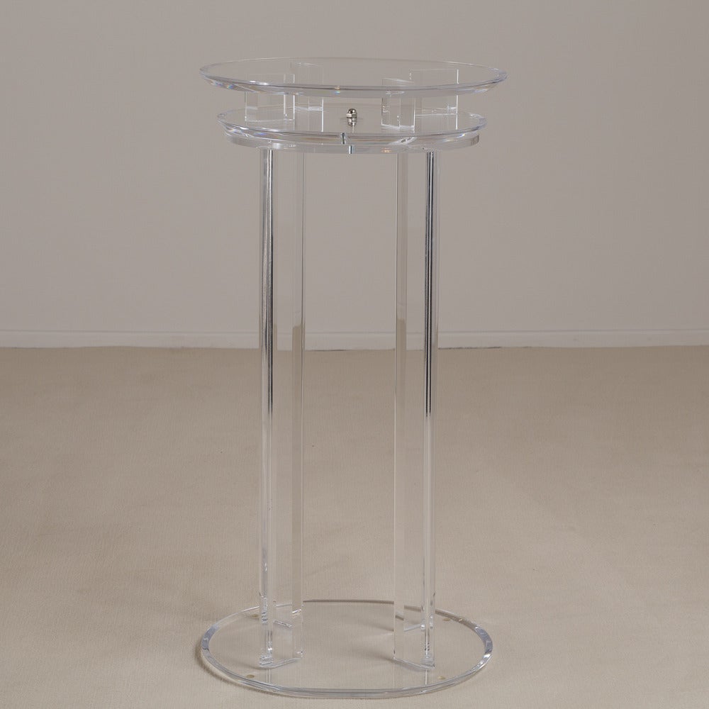 Late 20th Century A Tall Lucite Pedestal with an Oval Revolving Top 1970s