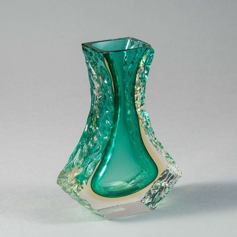 A Mandruzzato designed teardrop shaped Murano Sommerso glass vase with a turquoise and gold centre cased in clear glass with relief detail.