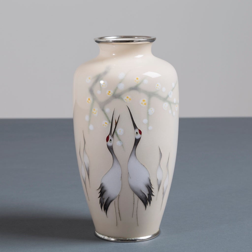 A Japanese cloisonné enamel vase depicting two cranes by Tamura, circa 1930.
