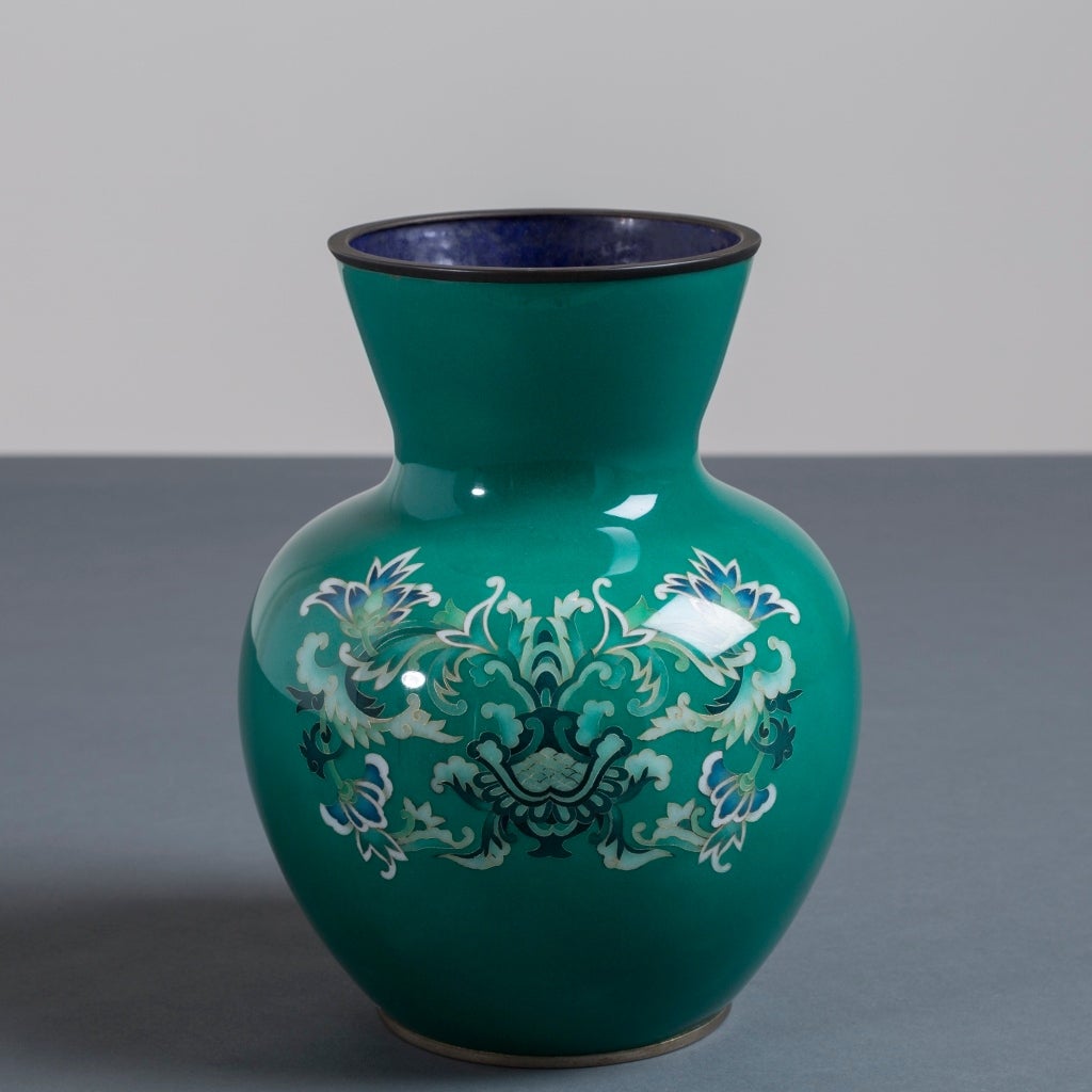 A Japanese cloisonné green enamel vase by Ando with abstract karakusa from the Showa period, circa 1950.