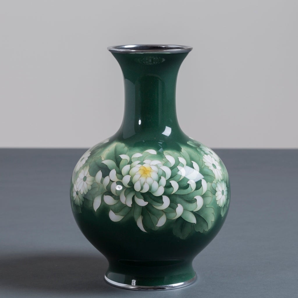 A Japanese cloisonne´ green enamel vase decorated with chrysanthemums and daisies attributed to Inarba from the Showa period 