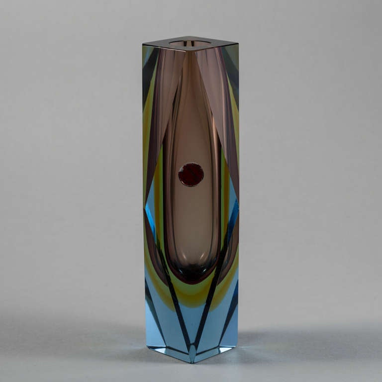 An unusual faceted Murano Sommerso glass vase with an amethyst, lime and gold centre cased in blue glass 1960s.