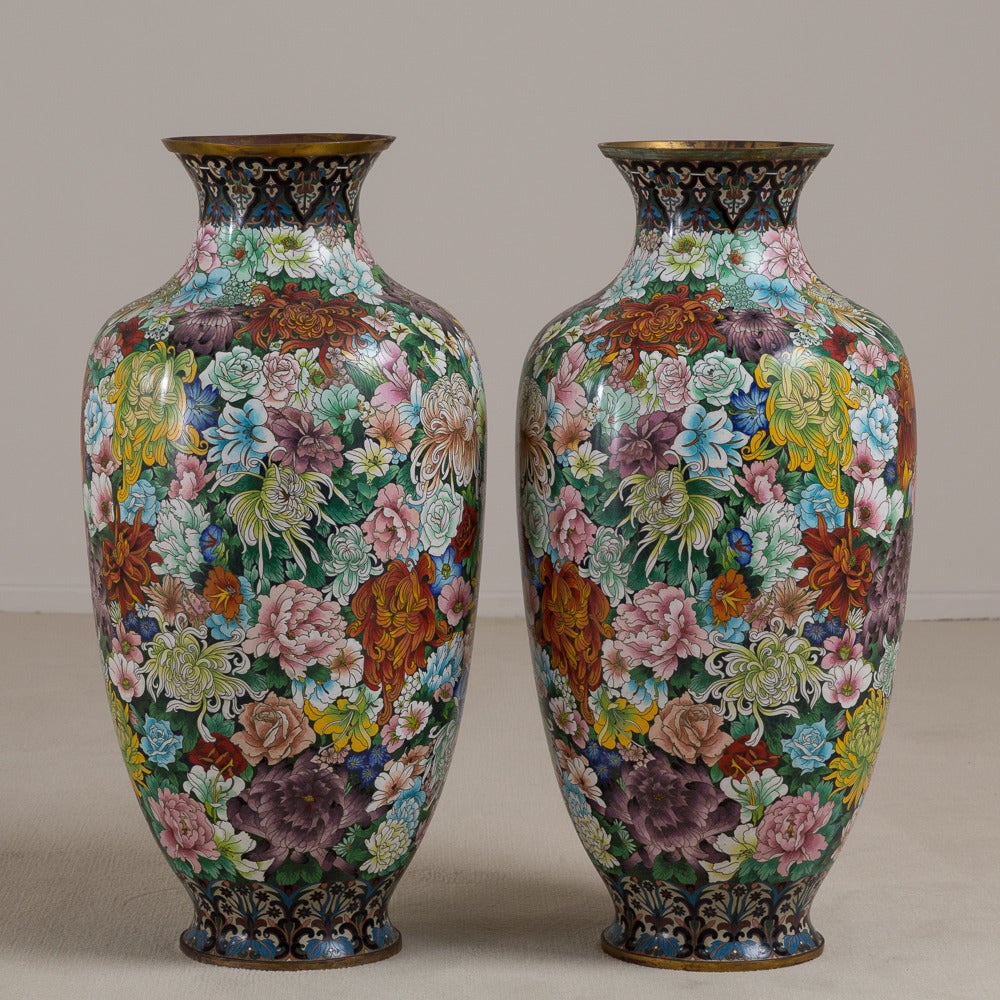 A pair of 20th century Chinese cloisonné vases with millefleurs decoration, circa 1930-1950.