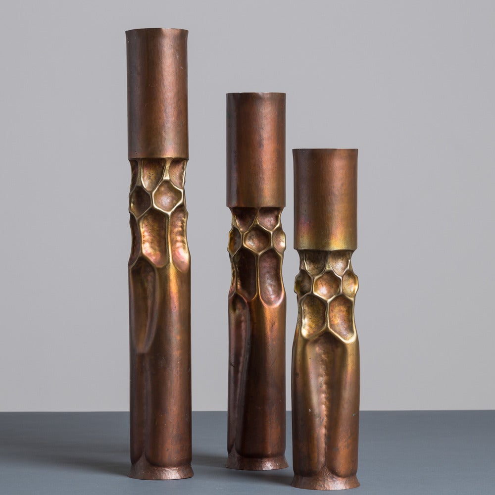 A set of three late 20th century Thomas Markusen Brutalist bronze candlesticks, stamped.