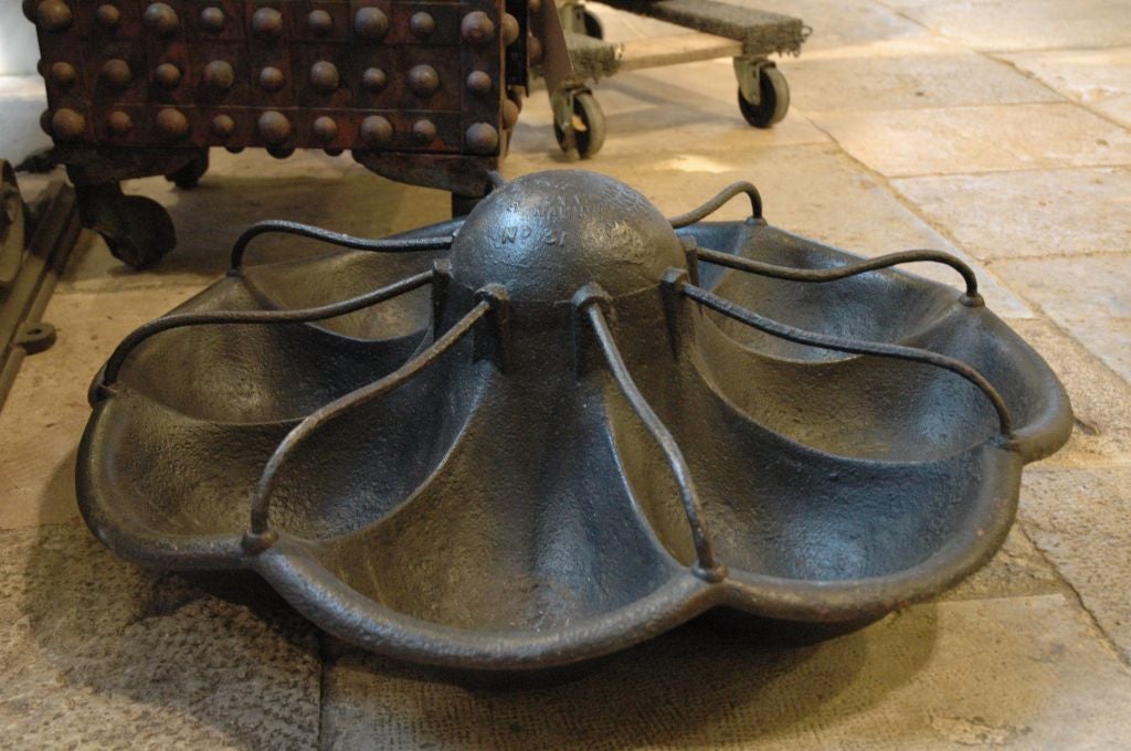 English, circa 1861, cast iron trough. Organic in design -- it is an exceptional & unique sculptural piece.. Originally it was a manger used to feed livestock. Cast into the center of the piece is, 
