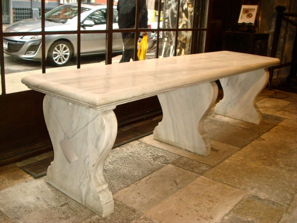 American, late 1890's, large marble bench. It was one of four benches located surrounding the indoor pool from Lynwood Hall at the P.A.B. Widener Estate. This bench is just over 7-1/2 feet long and is carved from a very unusual and rare marble -- it