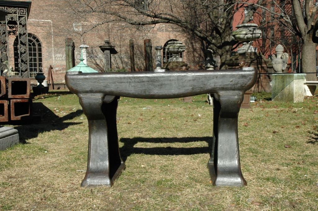 French, cast iron industrial table base. It is unique and of massive scale. Prefect as a dining table it can accommodate a 72 inch long piece of glass, marble or stone for the top. (table top not included)