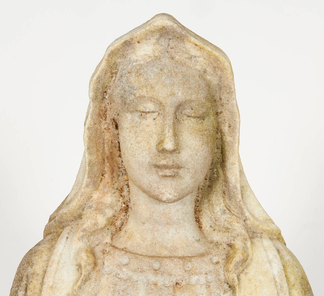 Fabulous hand-carved figure of Mary in aged patina of white marble.
Incredible detail of face, hands and robes with arms spread.