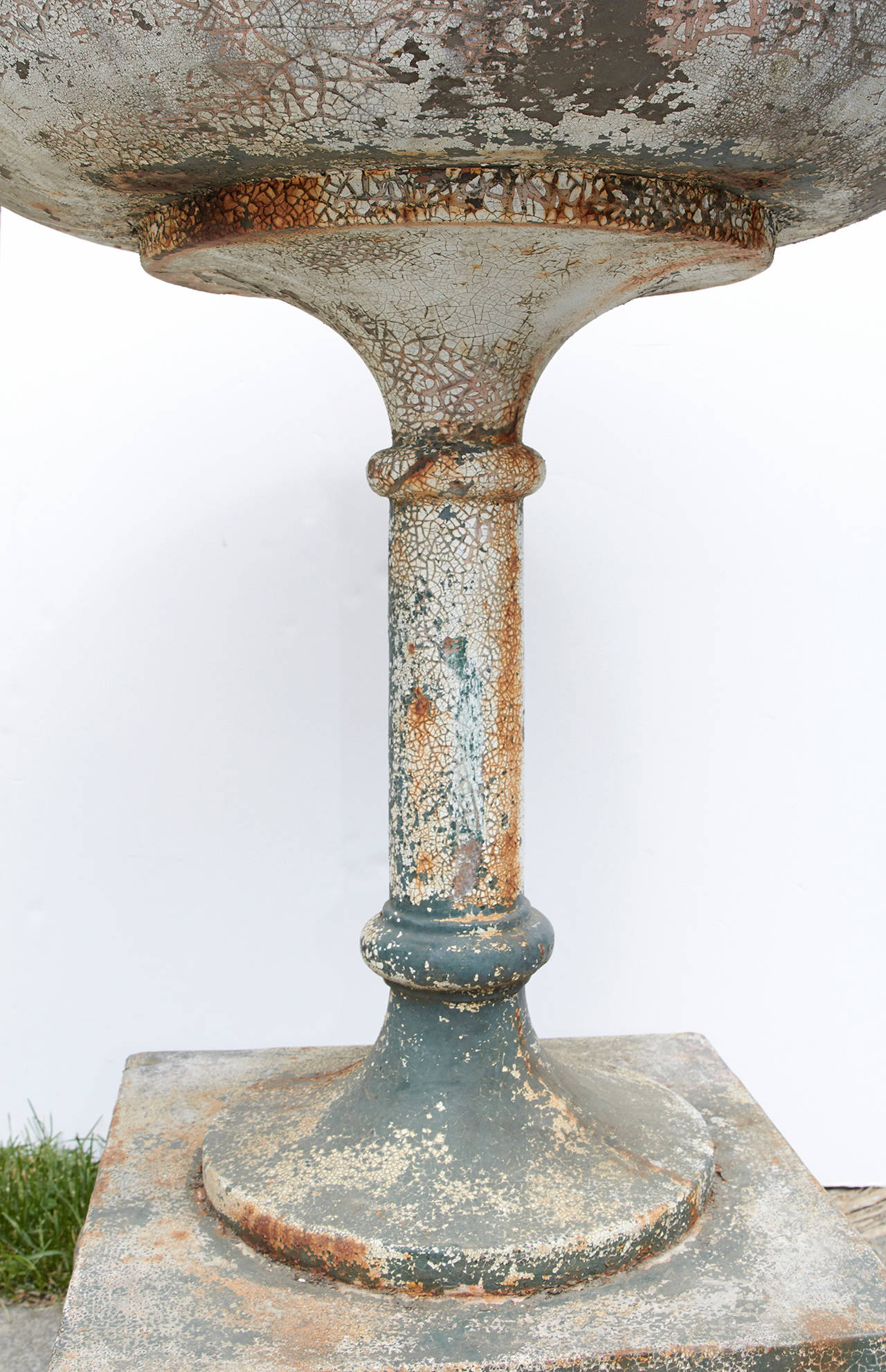 Incredibly unique pair of cast iron planters, French, circa 1900. Unique form with stepped rim over large bowl supported on an elongated pedestal. Probably architect designed for a special garden. Priced per pair. Two pairs are