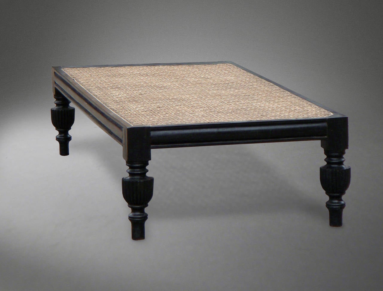 Anglo-Ceylonese Low Table in Solid Ebony with a Hard Caned Covered Top

Originally it had a large upholstered swab cushion