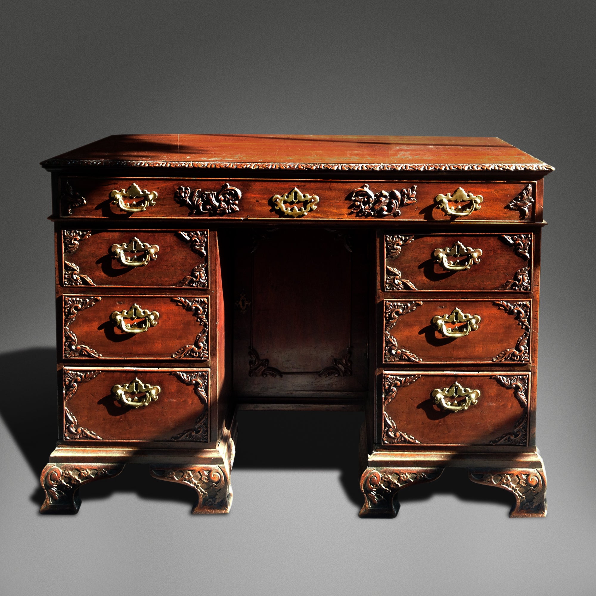 Small Mahogany Desk With Carved Detail And Brass Handles For Sale