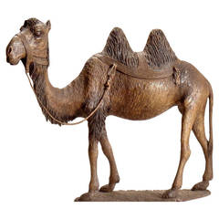 A Continental Stained and Polychrome Decorated Wood Model of A Camel