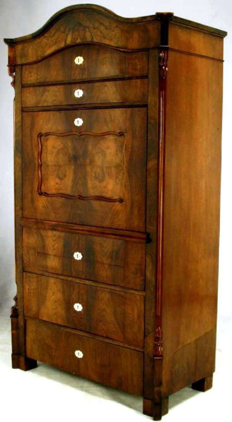 Biedermeier fourteen drawer secretary constructed of solid woods and beautiful burled walnut veneers. Escutcheons/keyholes are made of bone. With front in horizontal position, birdseye maple front drawers feature bone pulls. Also featured is green