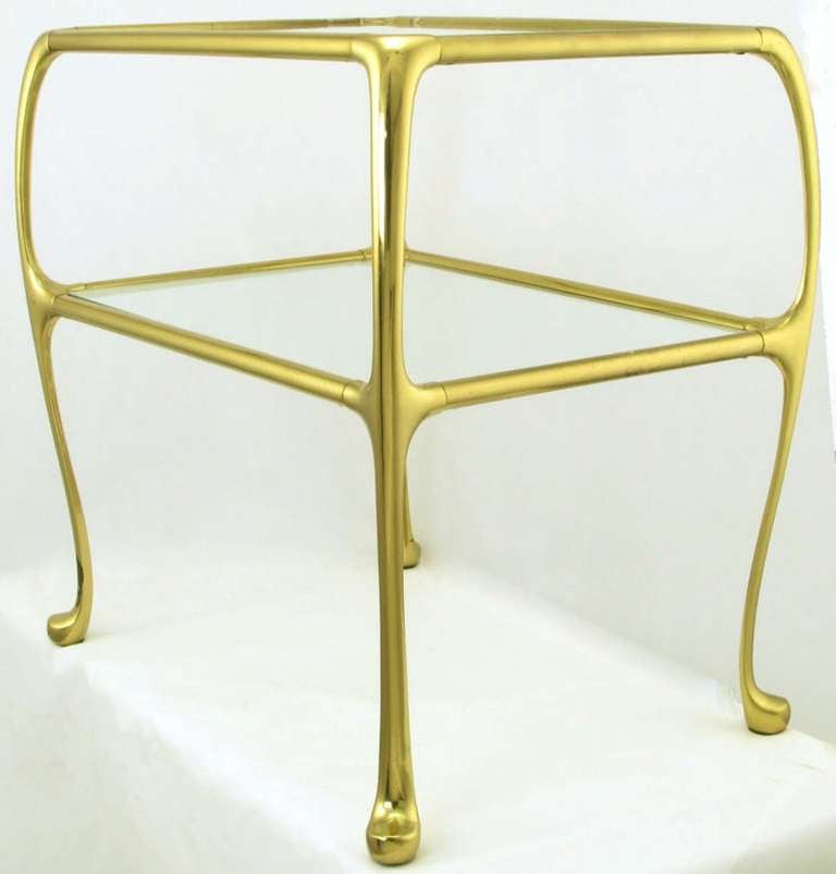 Elegant small side table with solid brass construction and fluid legs, reminiscent of Art Nouveau designs. Possibly a La Barge design.