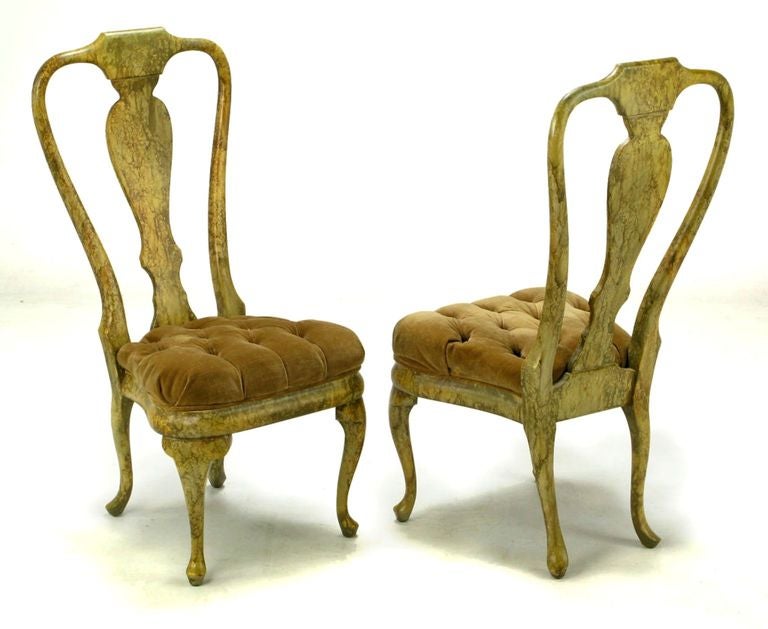 Exaggerated classical styling with a radical finish, this set of four Queen Anne dining chairs are beautiful Phyllis Morris Originals. The seats are thickly padded button tufted silk velvet. Unusual and striking set with button tufted seat a bit
