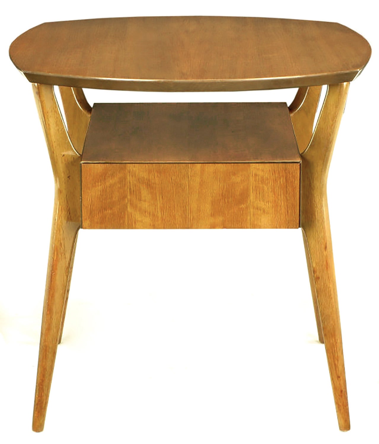 Figured Italian walnut side table with floating centre drawer from M.Singer and Sons. Figured Italian walnut, with canted angular legs that taper down to fine points and floating element.

Although Singer furniture was designed by Gio Ponti, Carlo