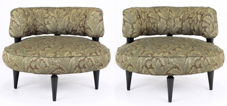 Uncommon art deco shape with round pouf-style seats and half round channeled back. Four black lacquered conical legs with carved top and black lacquered back risers that seem to perforate the seat cushion. Originally sold by venerable Chicago