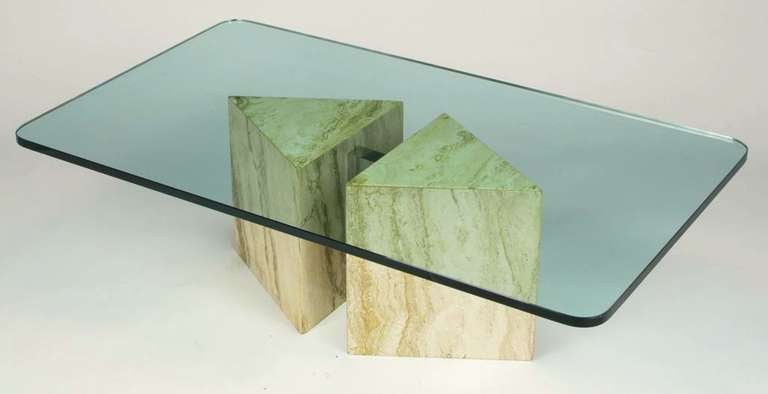Postmodern coffee table comprised of triangular dark veined travertine blocks connected by a chromed steel spacer. Top is 5/8