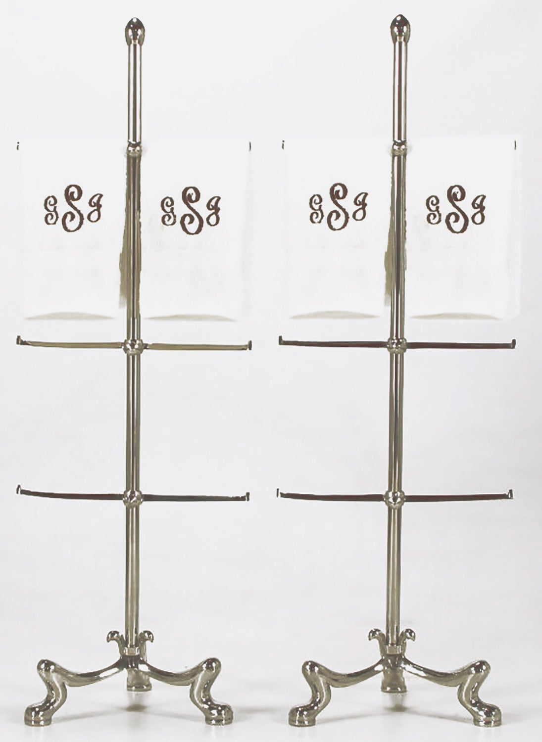 Pair of chrome-plated French Regency styles six bar towel holders. Paw feet tripod bases, with adjustable height bars on chrome-plated dowel with top finial. May also be used for visual storage of jewelry, or combined together with glass shelves for