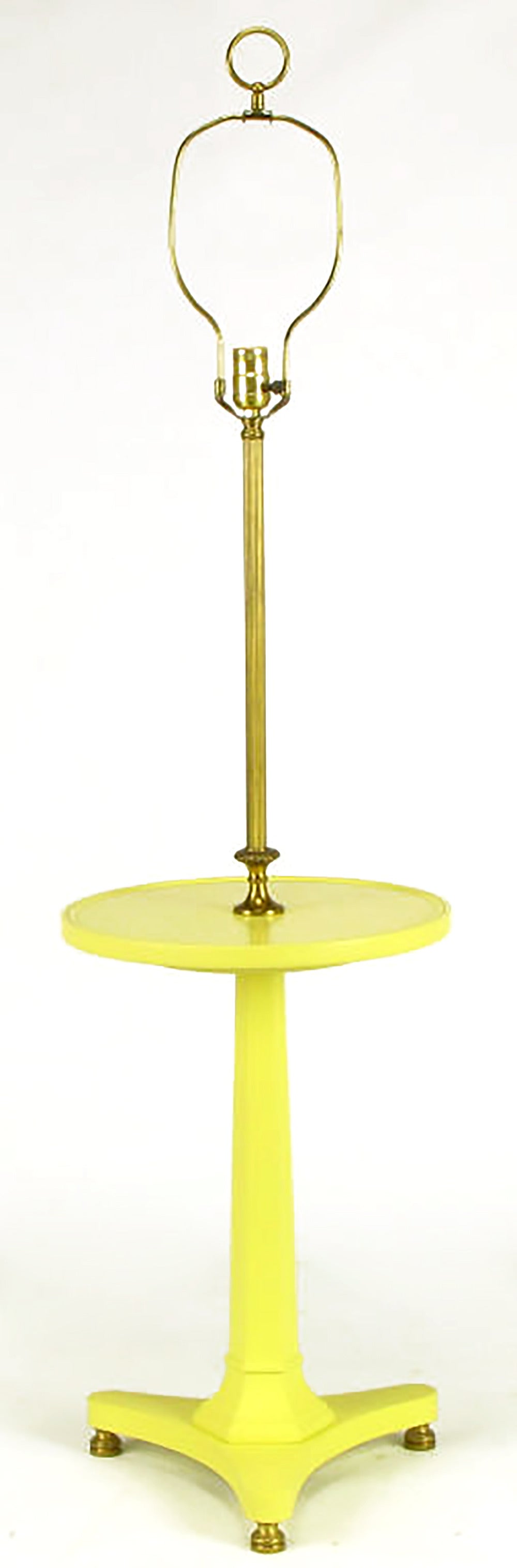 Butter yellow lacquer over carved wood Regency floor lamp with reverse trefoil base, solid brass feet and tapered hexagonal pedestal supporting a 14.5