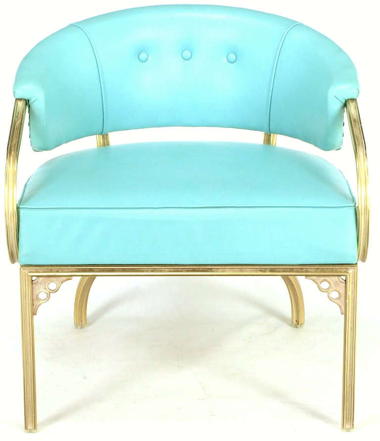 Very elegant set of four gold frame and turquoise vinyl upholstered American deco barrel back lounge chairs. Made by the Troy Sunshade Company, to John Van Koert's design. Scrolled and scalloped gold anodized aluminum frame has white glazing. Front
