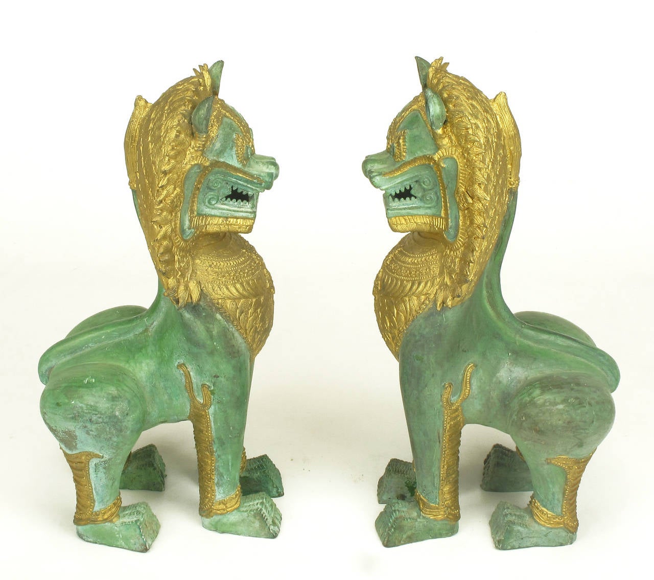 Pair of Parcel-Gilt Bronze Foo Dog Figures In Excellent Condition In Chicago, IL