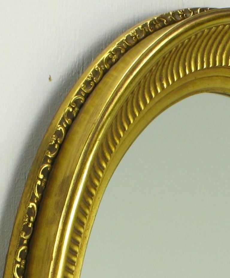 American Carved Wood & Gilt Oval French Regency Style Mirror For Sale