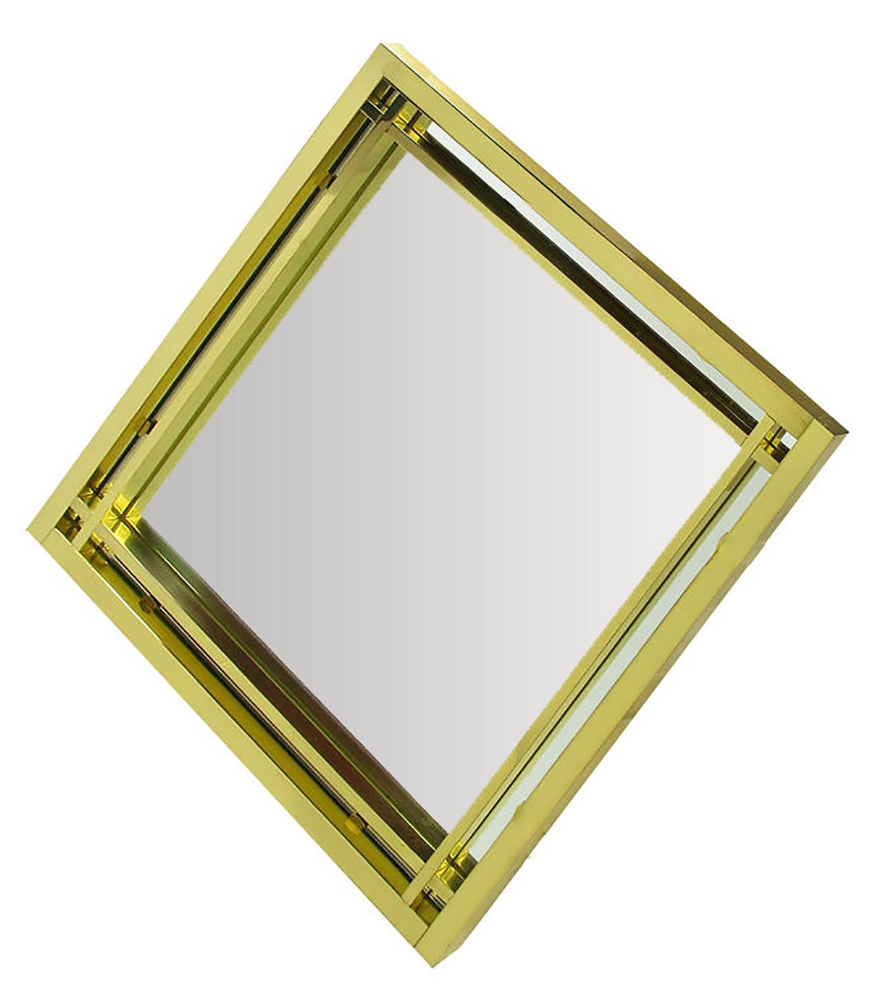 Elegant modern diamond shaped double framed mirror with open crossed corners in the style of Pierre Cardin. Excellent build quality and substantial, the mirror is outfitted with heavy duty hangers in verso. Acquired from an estate that included the