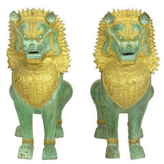 Pair of Parcel-Gilt Bronze Foo Dog Figures