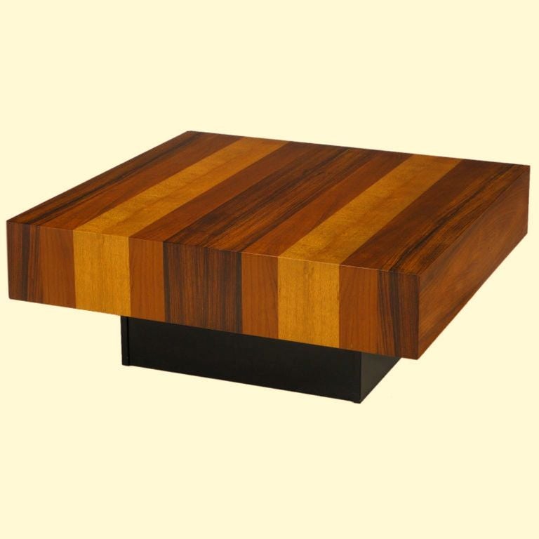 Dyrlund of Denmark parquetry wood square form coffee table with black lacquered recessed wood base. Clad in several exotic wood veneers including rosewood, curly maple, palisander, as well as teak. Surmounted on a black lacquered wood