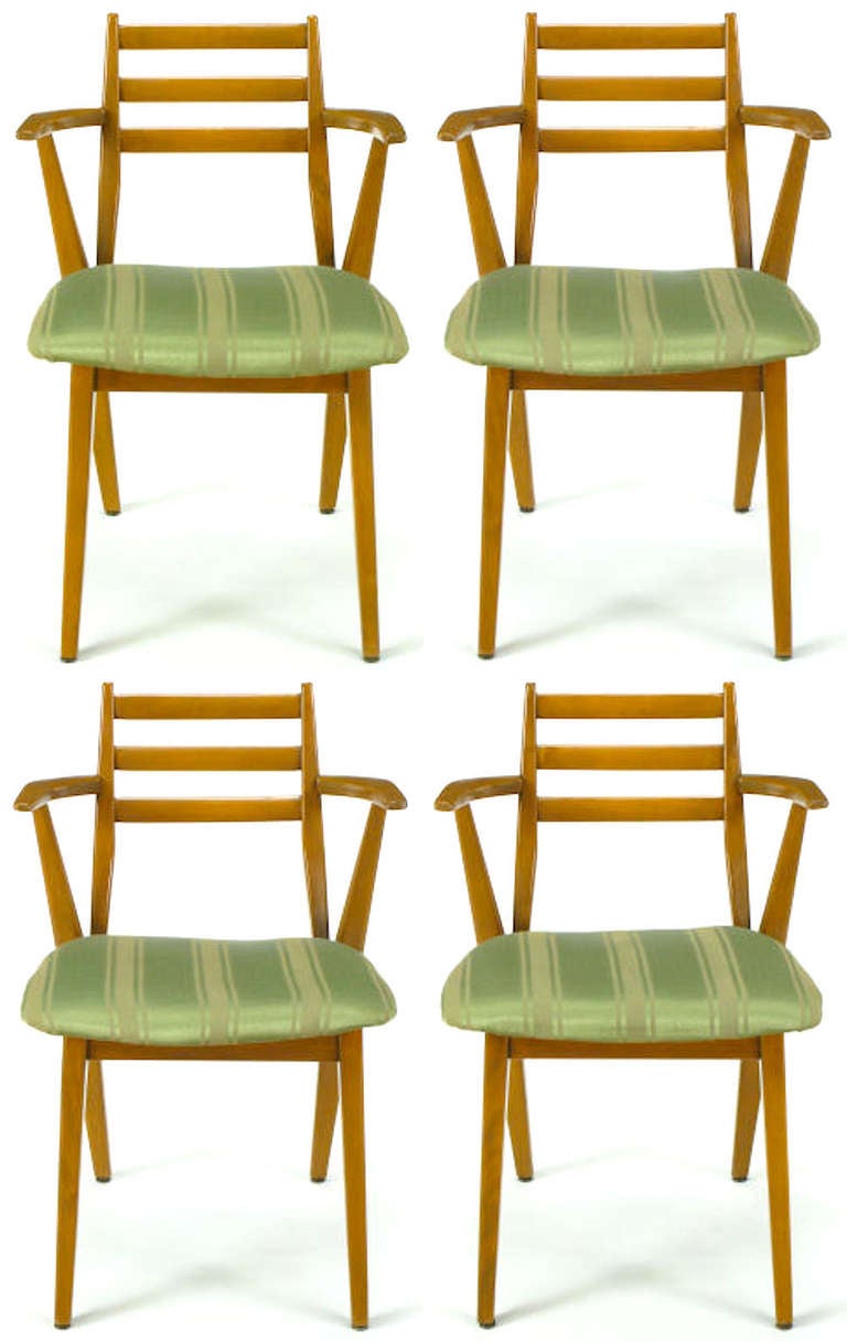 Striking set of four armchairs by Jan Kuypers for Imperial Contemporary of Canada. Constructed of solid birchwood with racing striped green silk and linen upholstered seats. Three slat open back with the back leg extending up to become the arm