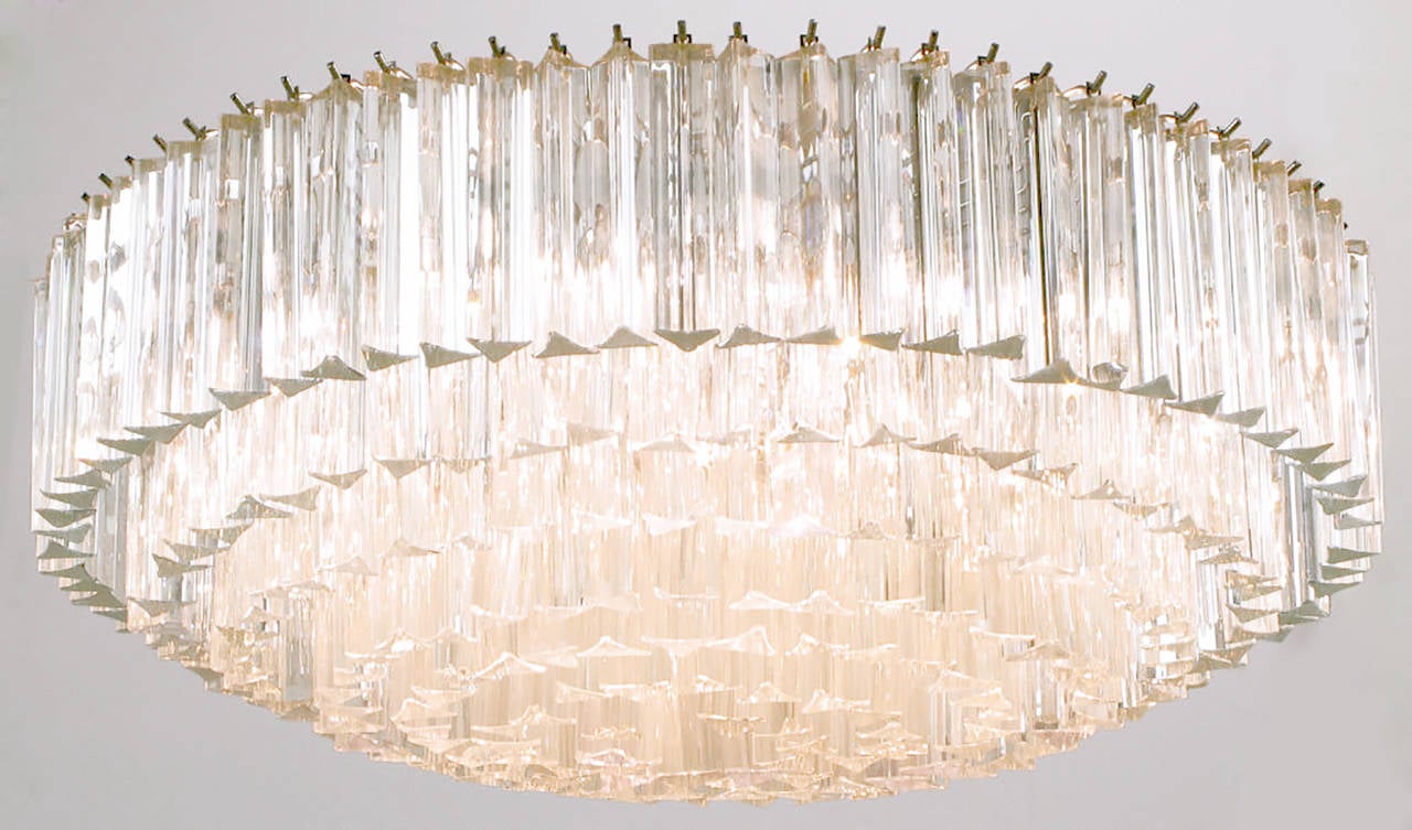 Large multi-tiered Murano glass crystal reverse wedding cake style chandelier by Venini. Chromed steel frame with 16 sockets. Measures 32 inch diameter.