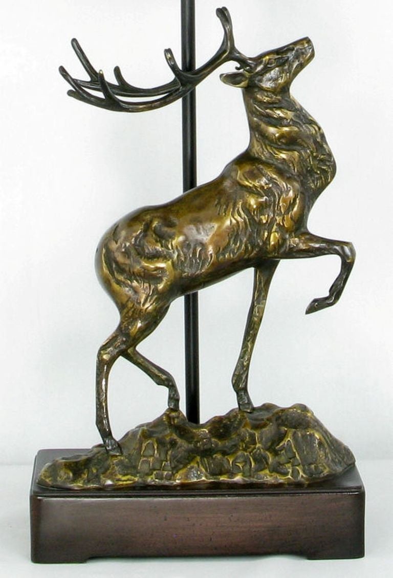 This masterfully cast bronze stag is perched on a cast resin base. Comes with it's custom black shade. Attributed to Chapman.
Shade measures14