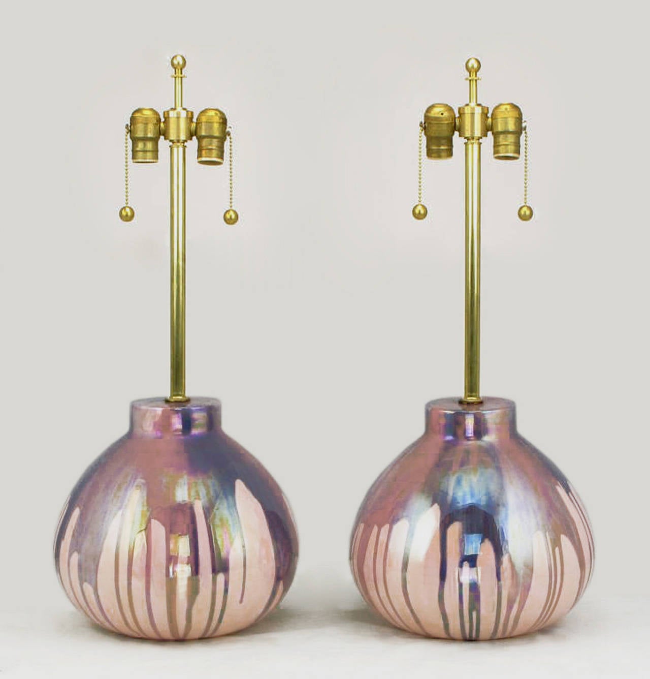 Pair of large bodied gourd form lavender and pink iridescent drip glaze pottery table lamps that are nearly 14