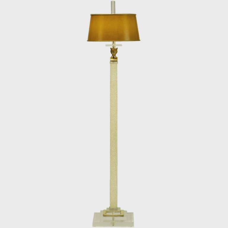 Empire revival floor lamp by Bauer Lamp Comapany. Lucite and brass plinth base,with Lucite cap and bobeche. The empire inspired bust of Mercury adorns the top of the stippled white and ivory lacquered square column. Lucite finial finishes the double